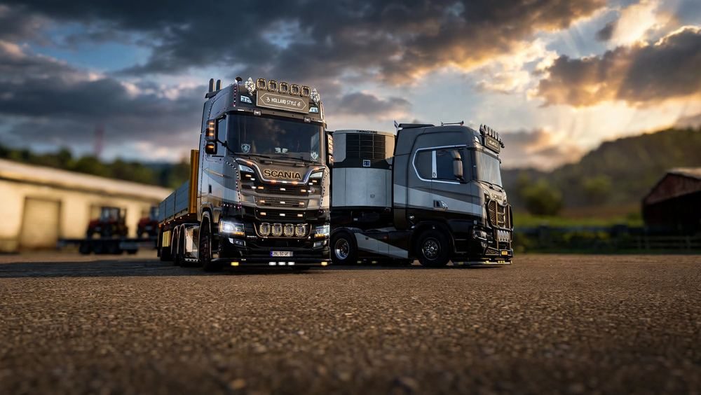 Two Scania trucks at golden hour