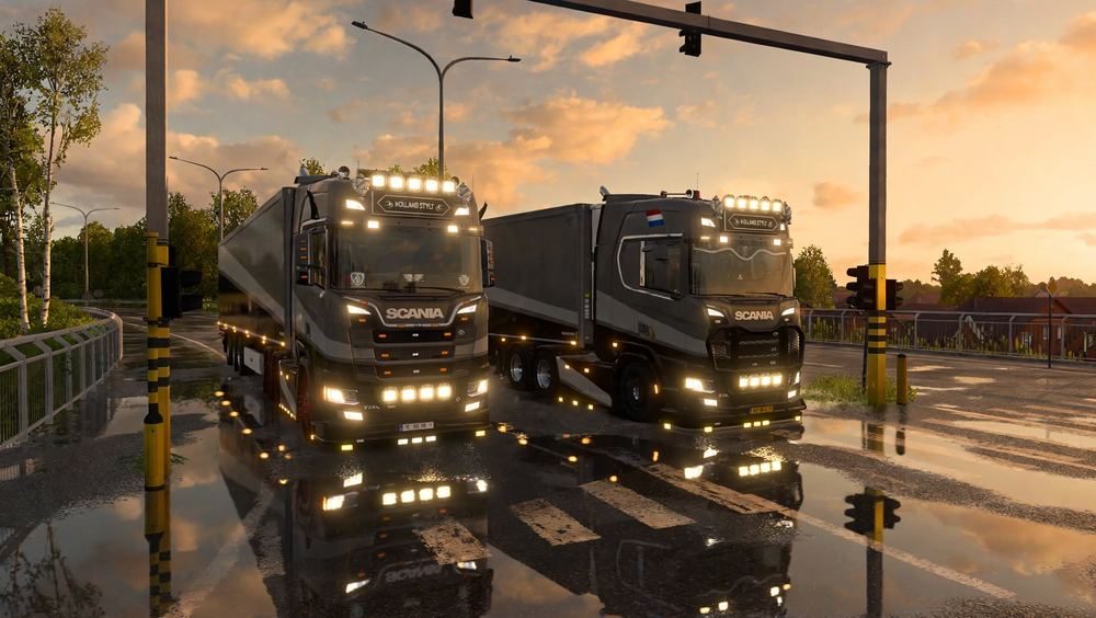 Two trucks at a junction at sunset